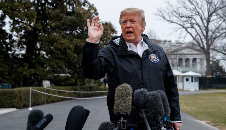 President Donald Trump talks with reporters outside the White House before traveling to Alabama to visit areas affected by the deadly tornadoes, Friday, March 8, 2019, in Washington. 