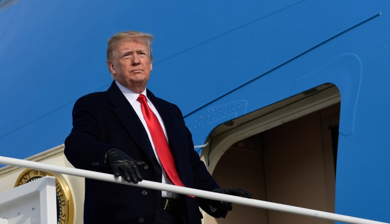 President Donald Trump pauses at the steps of Air Force One at Andrews Air Force Base in Md., Saturday, Dec. 8, 2018. Trump is heading to the Army-Navy Football Game in Philadelphia.