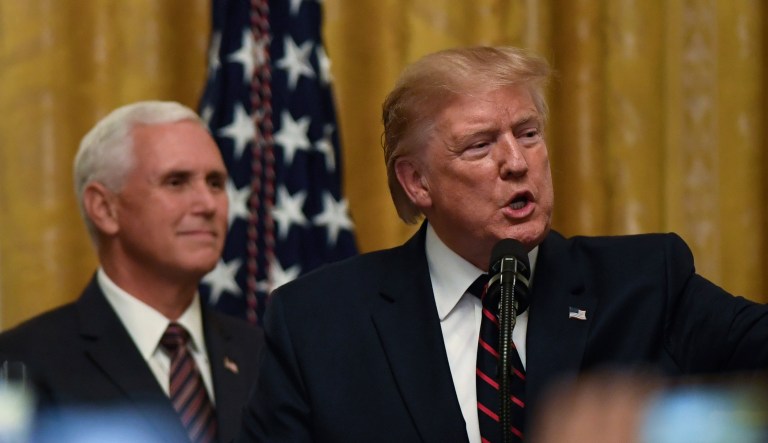 CORRECTS DAY OF WEEK TO FRIDAY FROM THURSDAY-President Donald Trump, right, standing with Vice President Mike Pence, left, speaks at the Hispanic Heritage Month Reception in the East Room of the White House in Washington, Friday, Sept. 27, 2019.