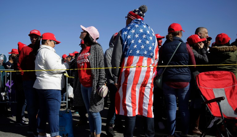 Supporters of President Donald Trump stand in line for his rally outside the El Paso County Coliseum, Monday, Feb. 11, 2019, in El Paso, Texas.