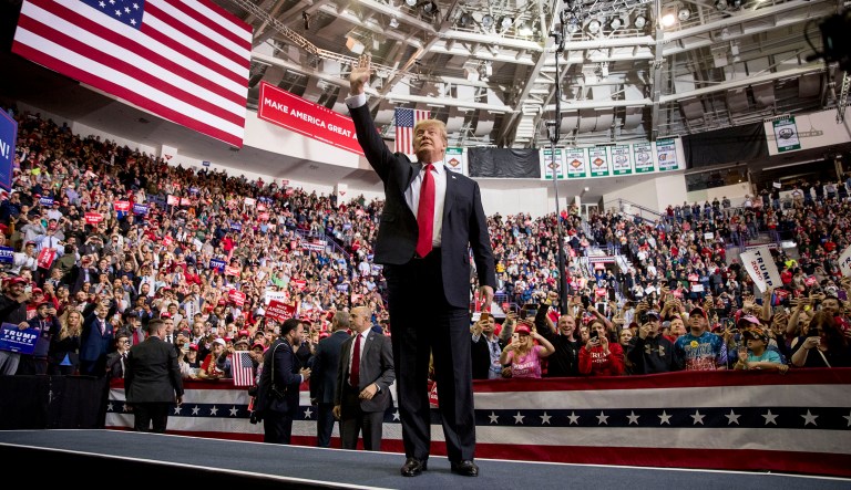 President Donald Trump, left, arrives at a rally at Resch Center Complex in Green Bay, Wis., Saturday, April 27, 2019.