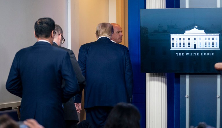President Donald Trump is asked to leave the James Brady Press Briefing Room by a member of the U.S. Secret Service during a news conference at the White House, Monday, Aug. 10, 2020.