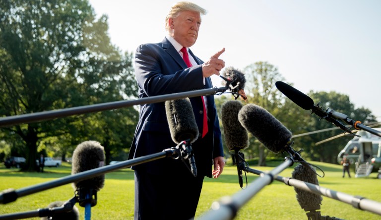 President Donald Trump takes a question from a member of the media on the South Lawn of the White House in Washington, Wednesday, Aug. 7, 2019.
