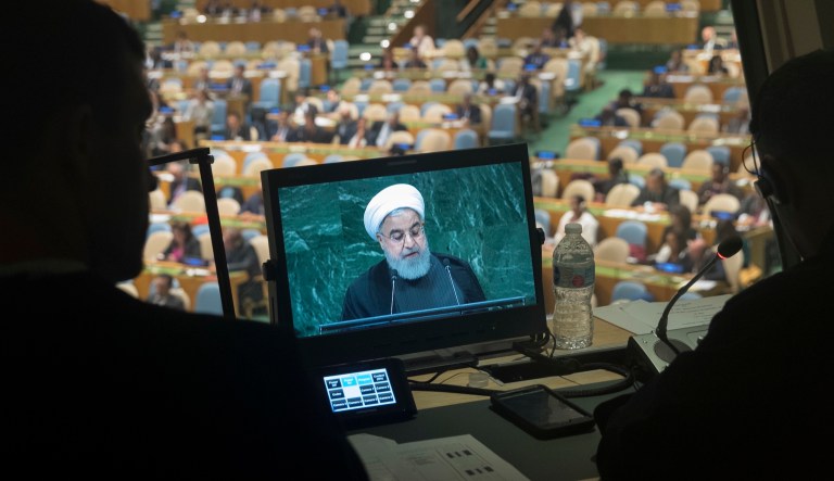 Iranian President Hassan Rouhani is seen on a translators video screen as he addresses the 73rd session of the United Nations General Assembly, Tuesday, Sept. 25, 2018, at U.N. headquarters.
