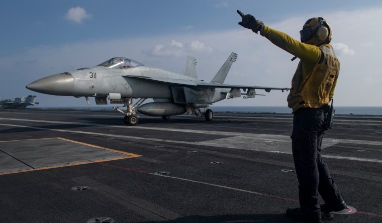 Defense secretary signals China will be major focus and plans visit to region
