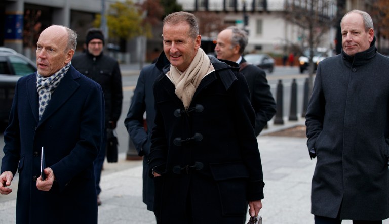 Volkswagen Group CEO Herbert Diess walks to speak with reporters after meeting with President Donald Trump at the White House, Tuesday, Dec. 4, 2018, in Washington.