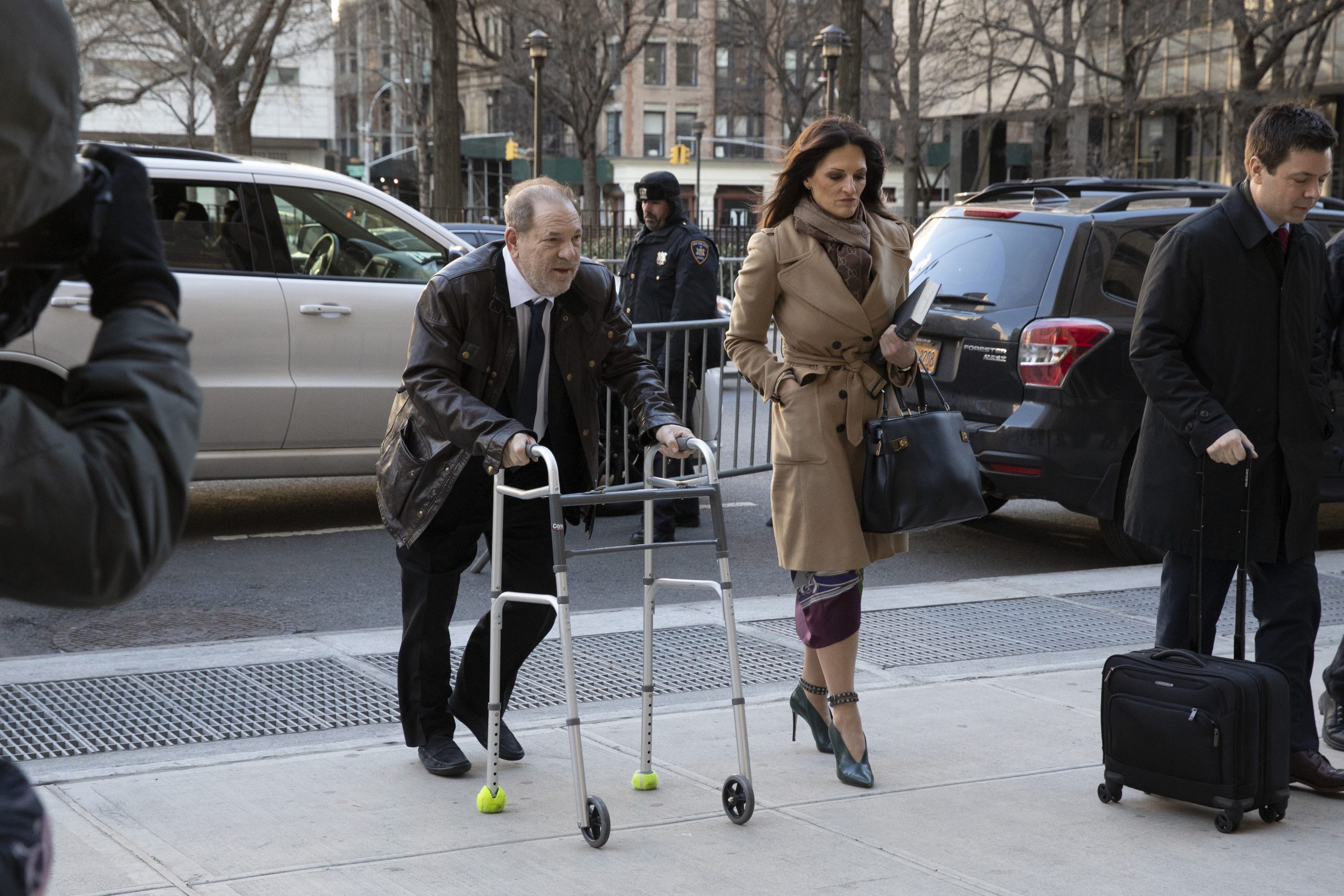 Weinstein shuffles into court
