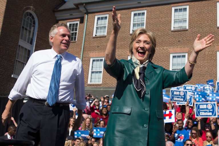 Democratic presidential candidate, former Secretary of State Hillary Rodham Clinton stands with longtime ally Virginia Gov. Terry McAuliffe during a campaign rally, Friday, Oct. 23, 2015, in Alexandria, Va. (AP Photo/Evan Vucci)