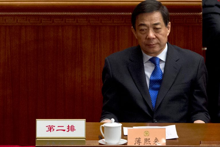  In this March 13, 2012 photo, former Chongqing Communist Party Secretary Bo Xilai attends the closing session of the Chinese People's Political Consultative Conference held in Beijing's Great Hall of the People, China. The new leadership in the southwestern Chinese city beset by a murder scandal that took down its Communist Party boss says lessons must be learned from the embarrassing episode and efforts made to repair the city's image. (AP Photo/Alexander F. Yuan)  