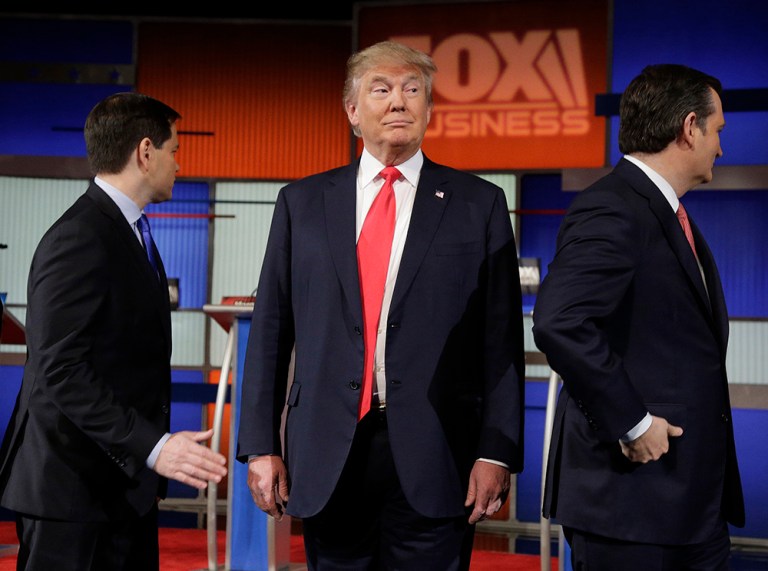 Republican presidential candidate, businessman Donald Trump stands on the stage before the Fox Business Network Republican presidential debate at the North Charleston Coliseum, Thursday, Jan. 14, 2016, in North Charleston, S.C. (AP Photo/Chuck Burton)