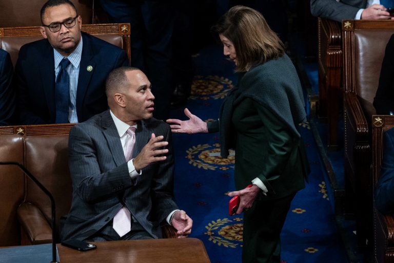 Democratic Leader Hakeem Jeffries speaks with former House Speaker Nancy Pelosi, in the House chamber, on Wednesday, Jan. 4, 2023. 