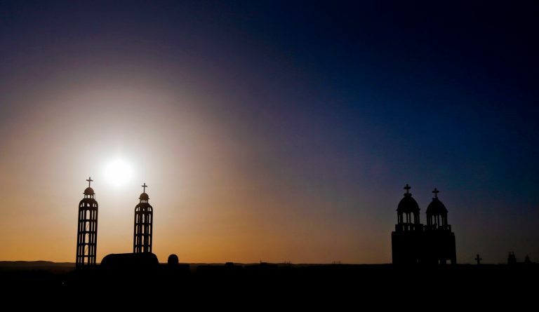   In this Tuesday, Dec. 18, 2012 photo, towers of churches are silhouetted against the sun in the village of El-Aziyah near the city of Assiut, southern Egypt. After a campaign of intimidation by Islamists, most Christians in this southern Egyptian province were too afraid to participate in last weekâs referendum on an Islamist-drafted constitution they desperately oppose, residents say. Some of the few who dared try to reach polls were pelted by stones. The disenfranchising hikes Christiansâ worries over their future under Egyptâs empowered Islamists, but some young members of the community are starting to push back.(AP Photo/Petr David Josek)  