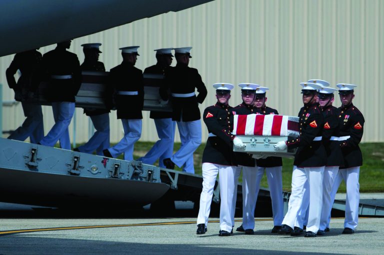Carry teams move flag draped transfer cases of the remains of the four Americans killed this week in Benghazi, Libya, from a transport plane during the Transfer of Remains Ceremony, Friday, Sept. 14, 2012, at Andrews Air Force Base, Md., marking the return to the United States of the remains of the four Americans killed this week in Benghazi, Libya. (AP Photo/Carolyn Kaster)