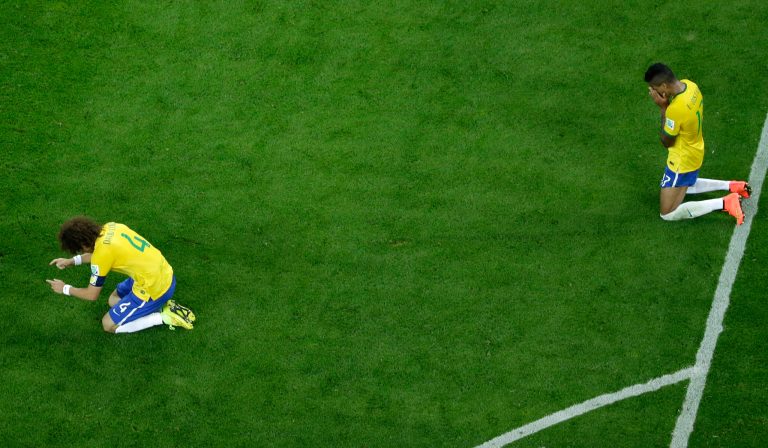 Brazil's David Luiz, left and Luiz Gustavo react after the World Cup semifinal soccer match between Brazil and Germany at the Mineirao Stadium in Belo Horizonte, Brazil, Tuesday, July 8, 2014. Germany has routed host Brazil 7-1 and advanced to the final of the World Cup. (AP Photo/Felipe Dana, Pool)