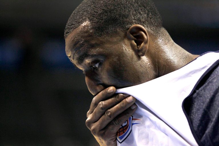   Oklahoma City Thunder's Kendrick Perkins pauses between shooting baskets during basketball practice, Wednesday, June 13, 2012, in Oklahoma City. Game 2 of NBA finals between the Miami Heat and the Thunder is Thursday. (AP Photo/Sue Ogrocki) (AP Photo/Jeff Roberson)  