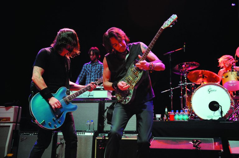 Musician Dave Grohl, left, and Rick Springfield perform on stage at the Sound City Players concert at The Manhattan Center Hammerstein Ballroom, Wednesday, Feb. 13, 2013, in New York. (Photo by Brad Barket/Invision/AP)