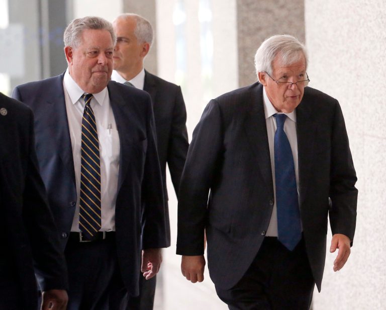 Former House Speaker Dennis Hastert, right, departs the federal courthouse with his attorney in Chicago. An attorney for Hastert told a federal judge that the former House speaker intends to plead guilty in a federal hush-money case during a hearing Thursday. (AP Photo/Charles Rex Arbogast, File)