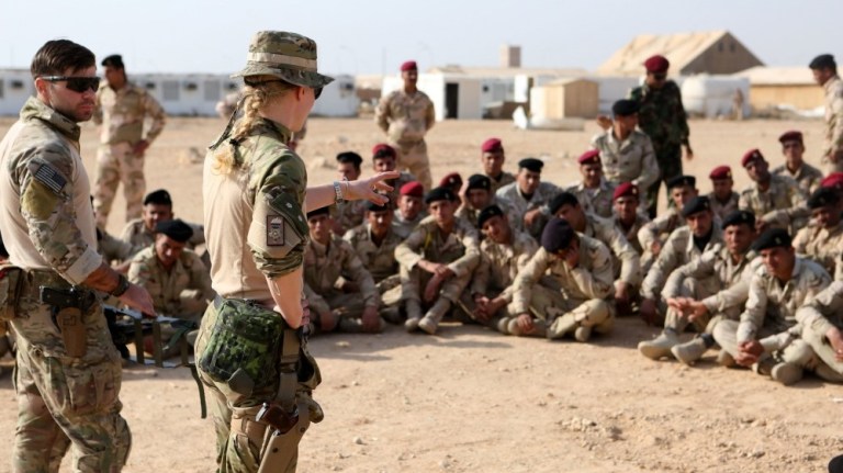 Coalition forces with Task Force Al Asad instruct and translate information on counter improvised explosive device training to Iraqi Security Forces aboard Al Asad Air Base, Iraq, Feb. 3, 2015. 