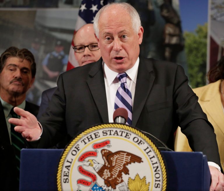 Gov. Pat Quinn speaks after signing a bill that will allow Illinois voters to register on Election Day, have more time to vote early, and not be required to bring photo identification to vote early, Tuesday, July 1, 2014, in Oak Park, Ill. The new law only applies to the November election. Sponsors say they want a trial run but do want to expand it beyond. County election officials say spots to register on Election Day will be limited to specific locations this election. (AP Photo/M. Spencer Green)