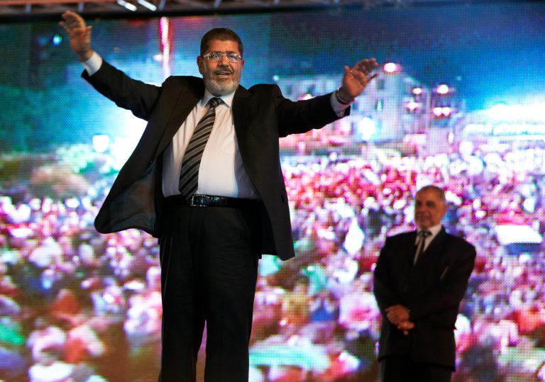 In this Sunday, May 20, 2012 file photo, the Muslim Brotherhood's presidential candidate Mohammed Morsi hold a rally in Cairo, Egypt. Egypt's electoral commission announced Sunday, June 24, 2012 that Morsi is victor of landmark presidential vote.(AP Photo/Fredrik Persson, File)