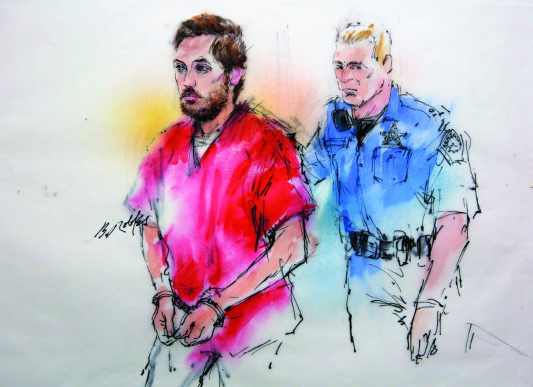 This courtroom sketch shows James Holmes being escorted by a deputy as he arrives at preliminary hearing in district court in Centennial, Colo., on Monday, Jan. 7, 2013. Investigators say Holmes opened fire during the midnight showing of the latest Batman movie on July 20, killing 12 people and wounding dozens. (AP Photo/Bill Robles, Pool) TV OUT