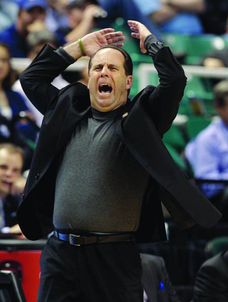 Chuck Burton/AP
Coach Mike Brey and Notre Dame will move from the Big East to the ACC.