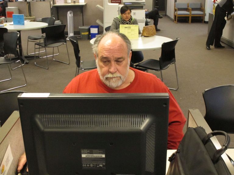 Richard Mattos, 59, looks for jobs at a state-run employment center in Salem, Ore., on Dec. 26. (AP Photo/Jonathan J. Cooper, File)