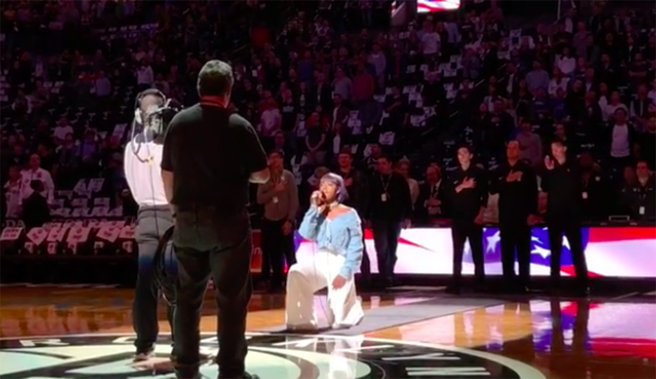 National anthem singer takes a knee while performing at Brooklyn Nets game