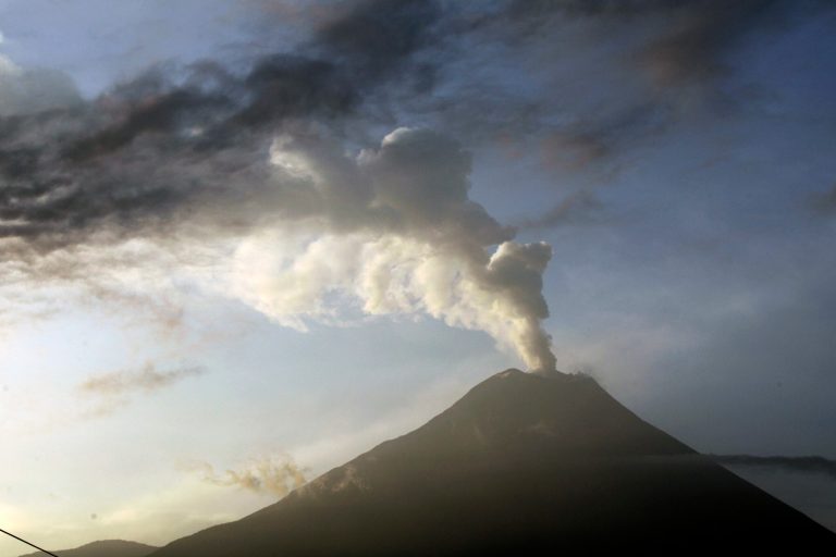   he Tungurahua volcano emits an an ash-filled plume as seen from Huambalo, Ecuador, Monday, Dec. 17, 2012. The country's National Geophysics Institute says that a constant plume of gas and ash is rising about half a mile (1 kilometer) above the crater, with ash falling on nearby communities. (AP Photo/Dolores Ochoa)  