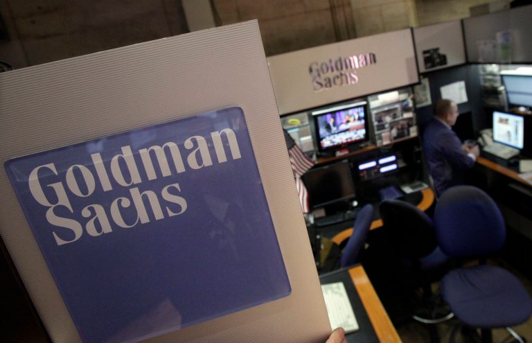 A trader works in the Goldman Sachs booth on the floor of the New York Stock Exchange. (AP Photo/Richard Drew)
