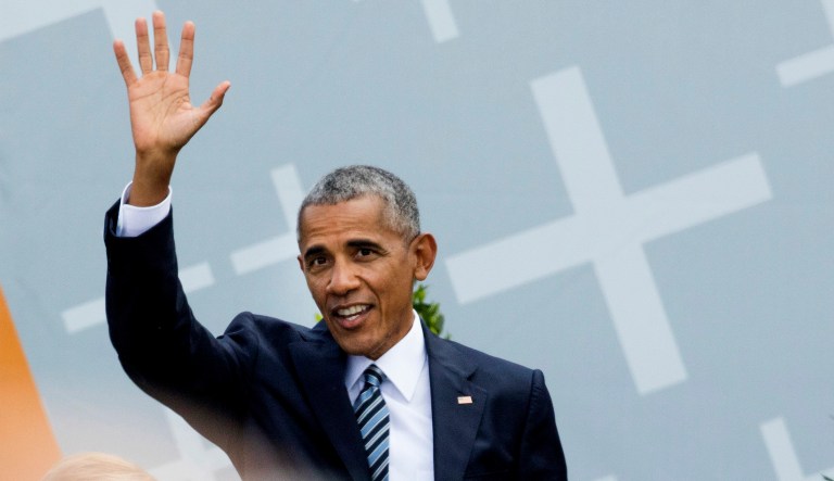 Former President Barack Obama waves to the crowd after a discussion event on democracy and global responsibility at a Protestant conference in Berlin, Germany, Thursday, May 25, 2017, when Germany marks the 500th anniversary of the Reformation. (AP Photo/Gero Breloer)