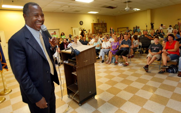 Republican presidential candidate and retired neurosurgeon Ben Carson laughs during a campaign stop at the American Legion Post 37 Thursday, Aug. 13, 2015, in Hooksett, N.H. (AP Photo/Jim Cole)