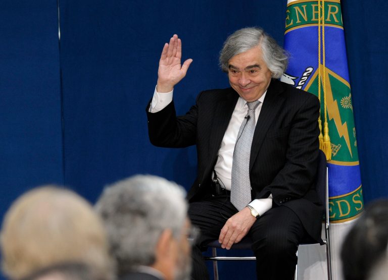 Dr. Ernest Moniz waves to the audience before the start of a ceremony where he was  sworn in as Energy Secretary, Tuesday, May 21, 2103,  at the Energy Department in Washington. (AP Photo/Susan Walsh)
