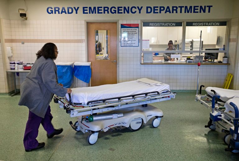 A worker wheels beds through the emergency department at Grady Memorial Hospital, in Atlanta. (AP Photo/David Goldman)
