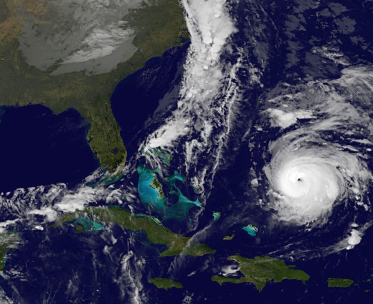 This image provided by NOAA Thursday Oct. 16, 2014 shows Hurricane Gonzalo, lower right. At 2 a.m. EDT Thursday the storm had top sustained winds near 125 mph (205 kph) and was centered about 555 miles (1,075 kilometers) south south-west of Bermuda early Thursday, the U.S. National Hurricane Center said. It was moving north at 9 mph (20 kph). (AP Photo/NOAA)