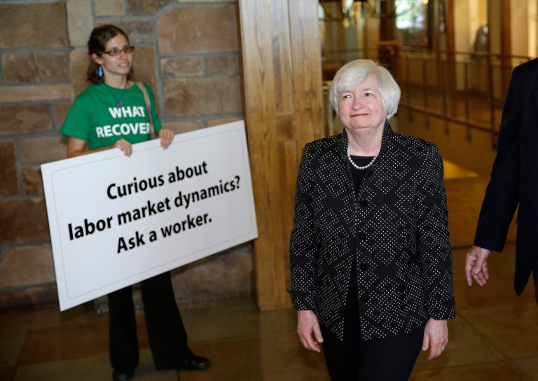 Federal Reserve Chair Janet Yellen, right, arrives for a dinner during the Jackson Hole Economic Policy Symposium at the Jackson Lake Lodge in Grand Teton National Park near Jackson, Wyo. Thursday, Aug. 21, 2014. (AP Photo/John Locher)