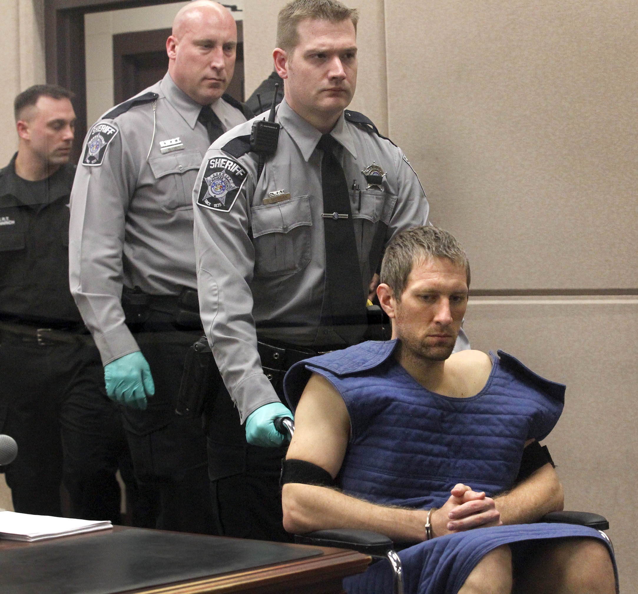 Husband charged in Wis. officer’s shooting death