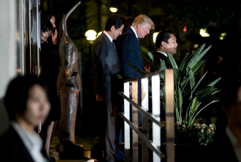 President Donald Trump, center right, and Japanese Prime Minister Shinzo Abe, center left, depart after having dinner with their wives at Ginza Ukai Tei restaurant, Sunday, Nov. 5, 2017, in Tokyo. (AP Photo/Andrew Harnik)