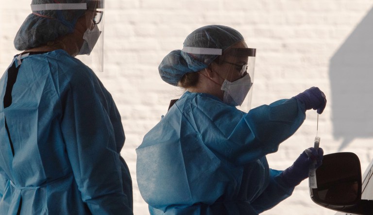 Healthcare workers prepare tests for COVID-19 at George Washington University Hospital in Washington, D.C.