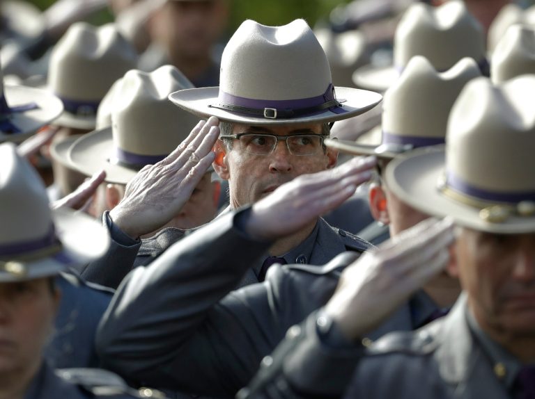 An unnamed state trooper is being grilled for telling Immigration and Customs Enforcement about one of their suspects last week. (AP Photo/Mike Groll)