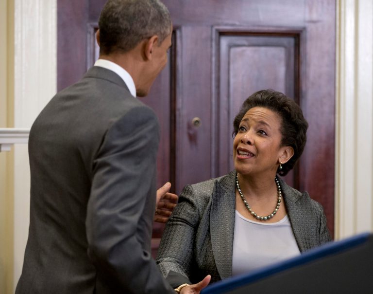 President Obama congratulates U.S. Attorney Loretta Lynch in the Roosevelt Room of the White House in Washington, Saturday, Nov. 8, 2014, where the president announced he would nominate Lynch to replace Attorney General Eric Holder. (AP Photo/Carolyn Kaster)