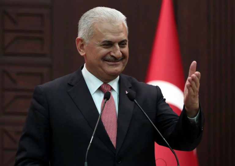 Turkey's Prime Minister Binali Yildirim announces the details of an agreement reached with Israel, in Ankara, Turkey, Monday, June 27, 2016. (AP Photo/Burhan Ozbilici)