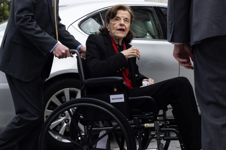 Sen. Dianne Feinstein (D-CA) is assisted to a wheelchair by staff as she returns to the Senate after a nearly three-month absence with shingles, at the Capitol, Wednesday, May 10, 2023.