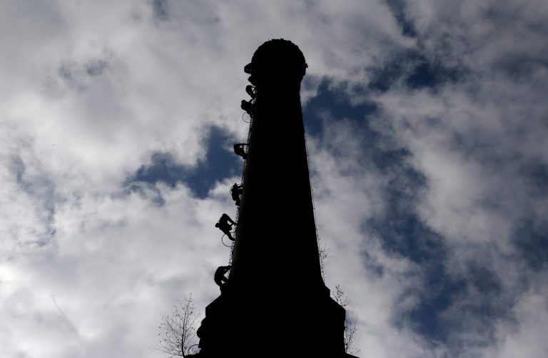 In this picture taken on Saturday, Sept. 27, 2014 in Smrzovka, Czech Republic, group of enthusiasts climbs up a 58-meter tall and 100-year-old chimney of a former textile factory. The Czech Union of Chimney Climbers, group of over 1000 members, has climbed and created a database of 9,755 chimneys in the Czech Republic and abroad with details including their exact GPS position, height and conditions. (AP Photo/Petr David Josek)
