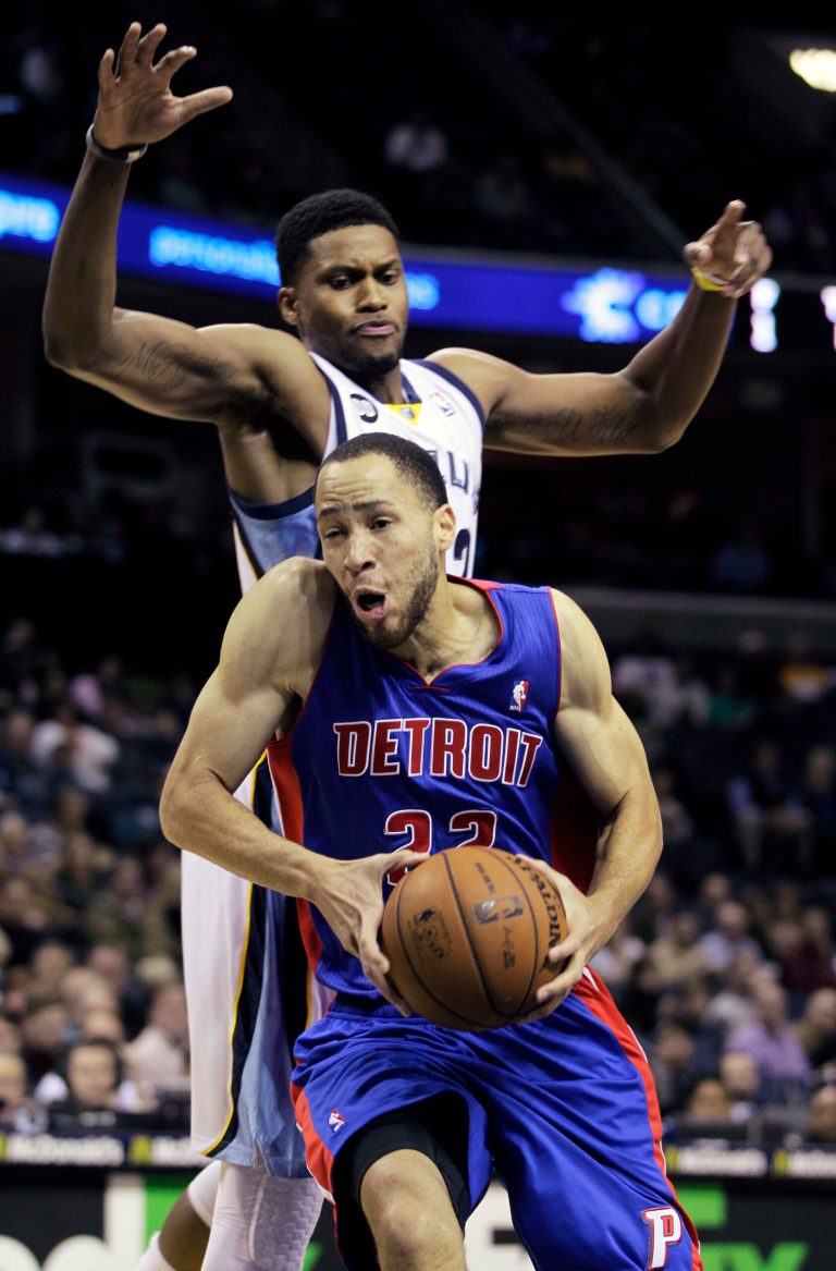   Detroit Pistons' Tayshaun Prince (22) goes to the basket under Memphis Grizzlies' Rudy Gay, top, in the first half of an NBA basketball game in Memphis, Tenn., Friday, Nov. 30, 2012. (AP Photo/Danny Johnston)  