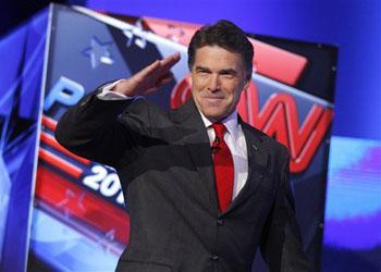 In fifth debate, Perry finally shows up