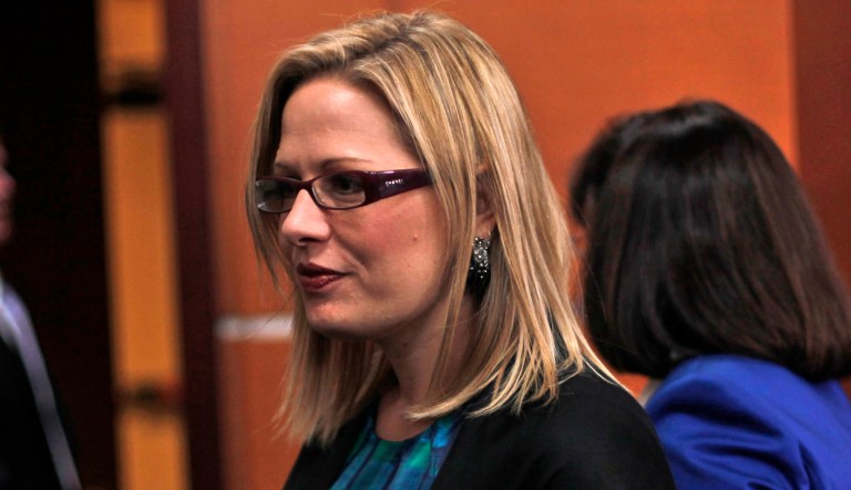 In one of their earlier exchanges, Amos Olagunju reportedly reached out to Rep. Kyrsten Sinema, D-Ariz., in 2014 to 