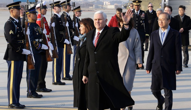 U.S. Vice President Mike Pence waves upon his arrival at Osan Air Base in Pyeongtaek, South Korea, Thursday, Feb. 8, 2018. (AP Photo/Ahn Young-joon. Pool)