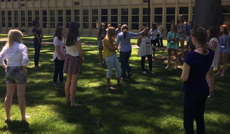 Students participate in a privilege walk. (Photo via Facebook)