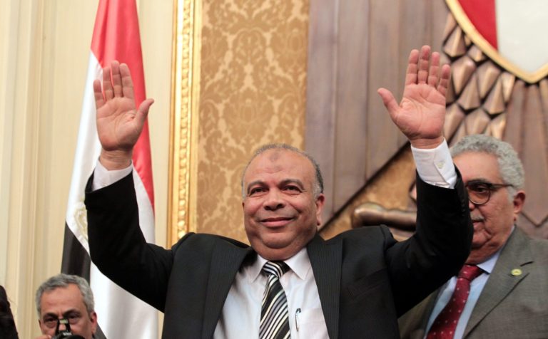 FILE - In this Monday, Jan. 23, 2012 file photo, Saad el-Katatni, Egypt's then newly-elected parliament speaker gestures during the first session after the revolution that ousted former President Hosni Mubarak, in Cairo, Egypt. Egypt's highest administrative court dissolved Saturday, Aug. 9, 2014, the Freedom and Justice Party, the political party of the banned Muslim Brotherhood, and ordered its assets liquidated, in the latest move against the 86-year-old Islamist group. El-Katatni led the party after Morsi became the country's first freely elected president in 2012. He also served as speaker of the parliament, dominated by his party. The parliament was dissolved after Morsi's ouster. (AP Photo/Khaled Elfiqi, Pool, File)
